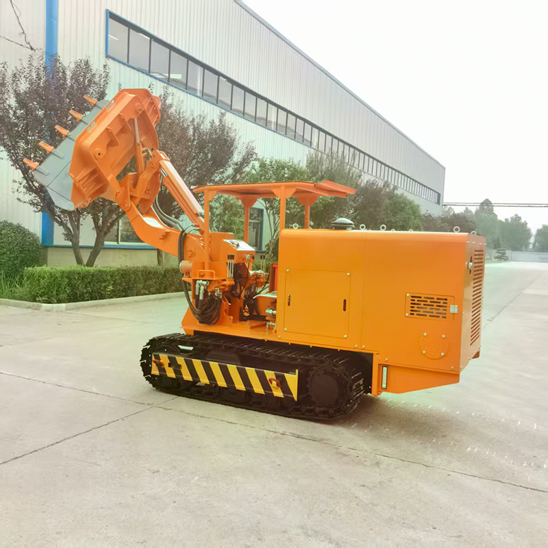 Chargeuse de roches à déchargement latéral sur chenilles