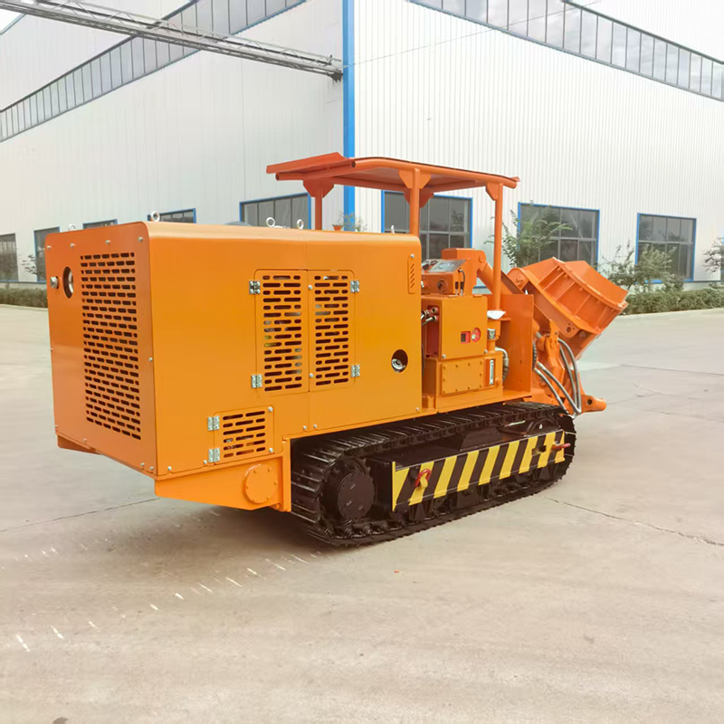 Chargeuse de roches à déchargement latéral sur chenilles